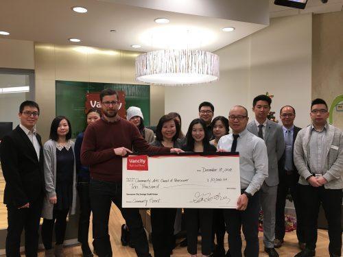 CACV Executive Director Eric Rhys Miller with Program Manager Johnny Trinh with Vancity Chinatown branch manager Grace Wong and staff